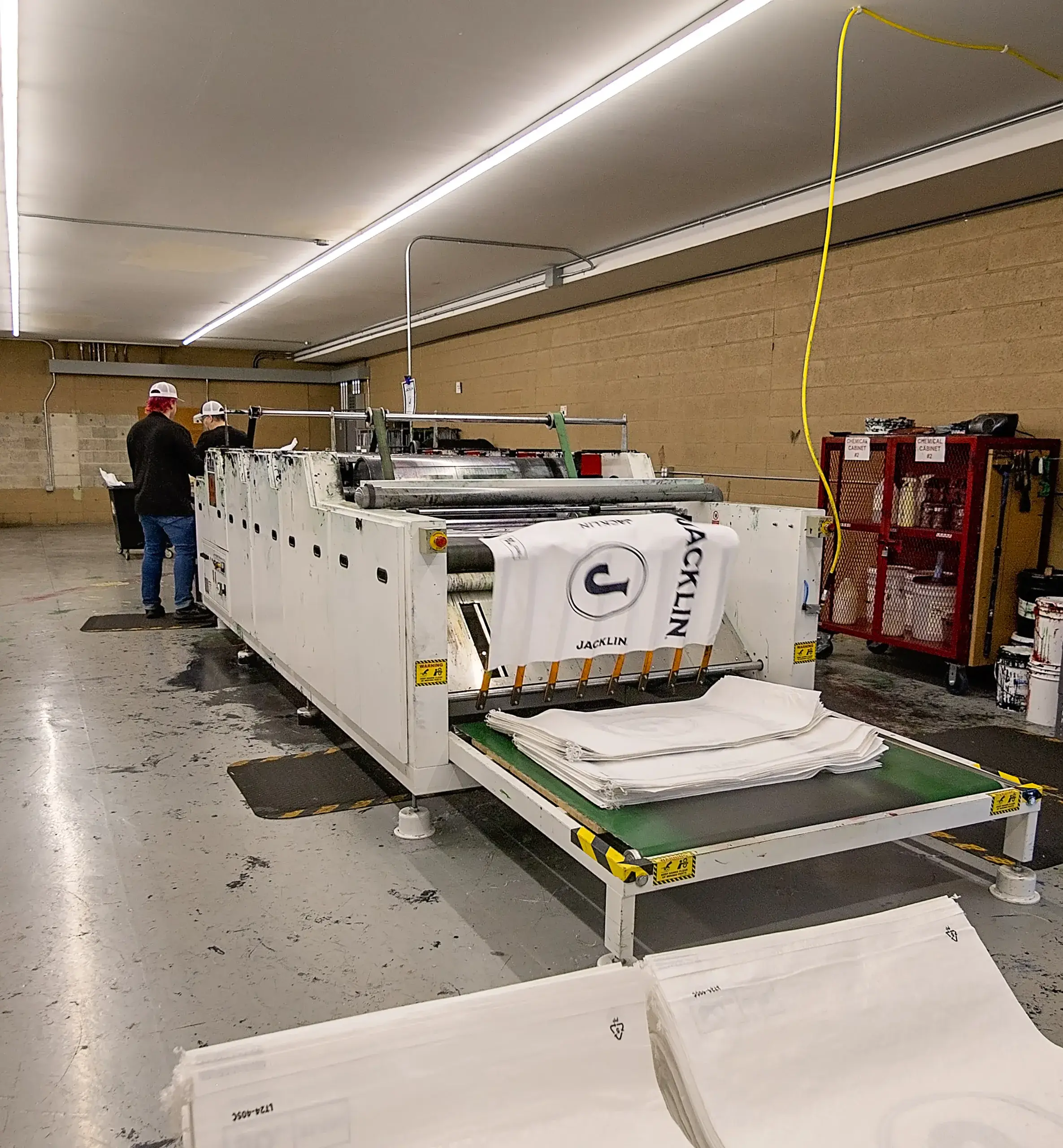 spokane-location-printing-main Employees standing at a bag printing press